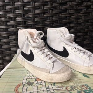 Nike White High-Top Sneakers with Black Swoosh